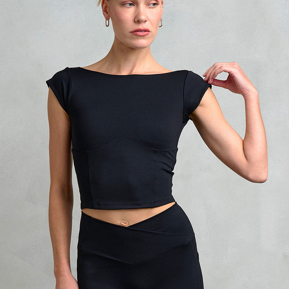 Our model is wearing the Camden square neck, backless top. Part of Stretch Studio London's new luxury athleisure collection, designed to take you from barre to brunch seamlessly.